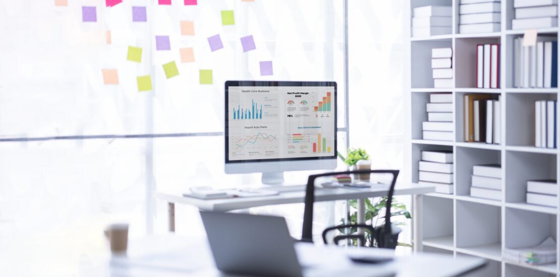 Laptop,Computer,,Notebook,,And,Eyeglasses,Sitting,On,A,Desk,In